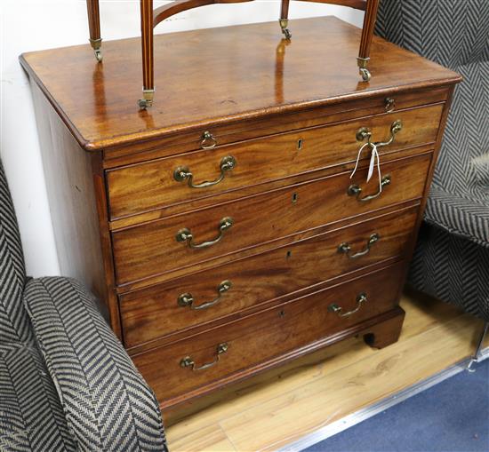 A George III mahogany four drawer chest with a brushing slide W.84cm